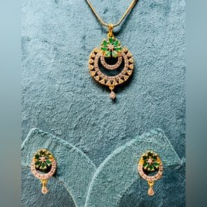 Gold tone and Silver tone  Crystal necklace with matching earrings.